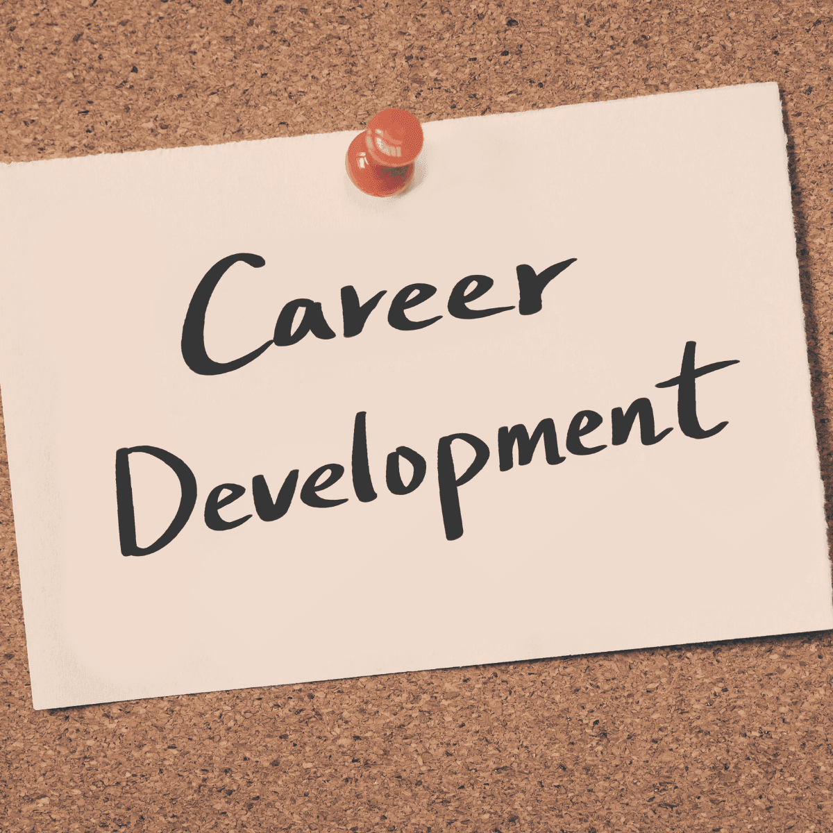 A paper pinned to a corkboard with the words 'Career Development' written on it.